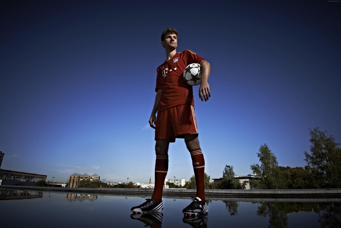 Thomas Muller of Bayern Munich holding a soccer ball