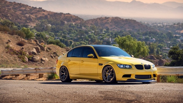 Yellow BMW M3 E90 Sedan on a Mountain Road
