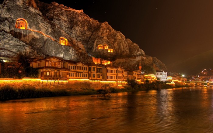 Amasya, Turkey at night with illuminated buildings and river