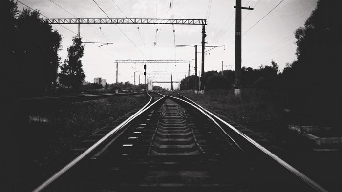 Train tracks splitting in monochrome