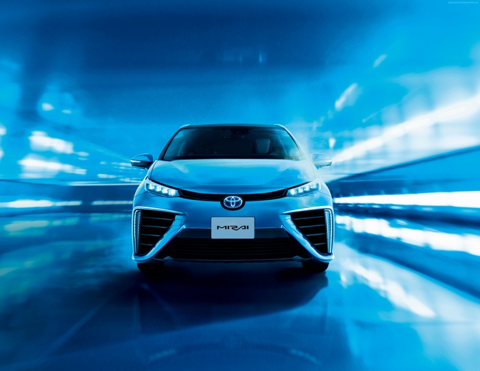 Toyota Mirai hydrogen car driving through blue tunnel