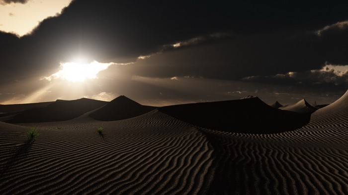 Desert Sand Dunes at Dusk with Dramatic Sunlight