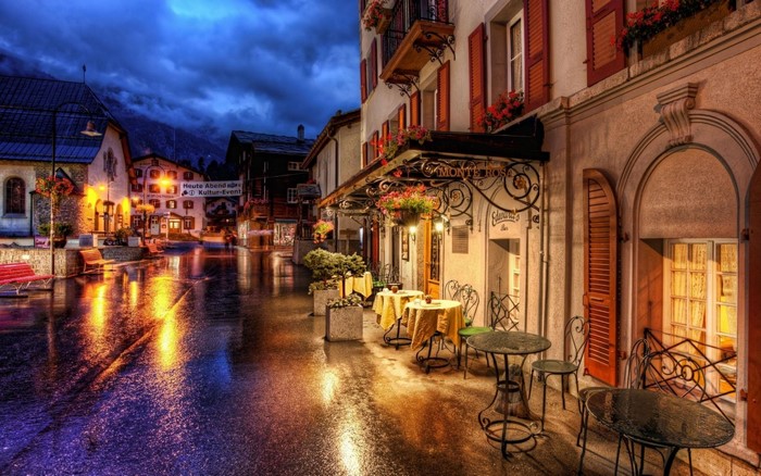 Street scene in a European town at night after rain