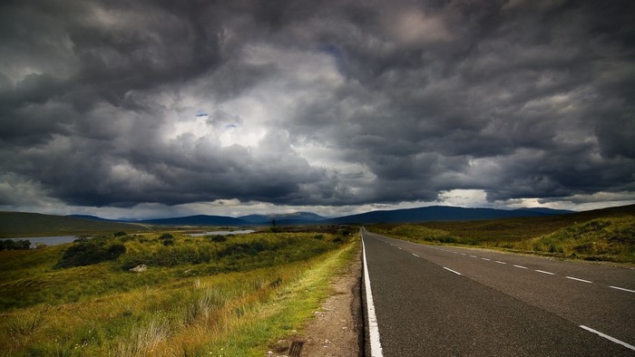 Stormy sky over a rural road in the highlands