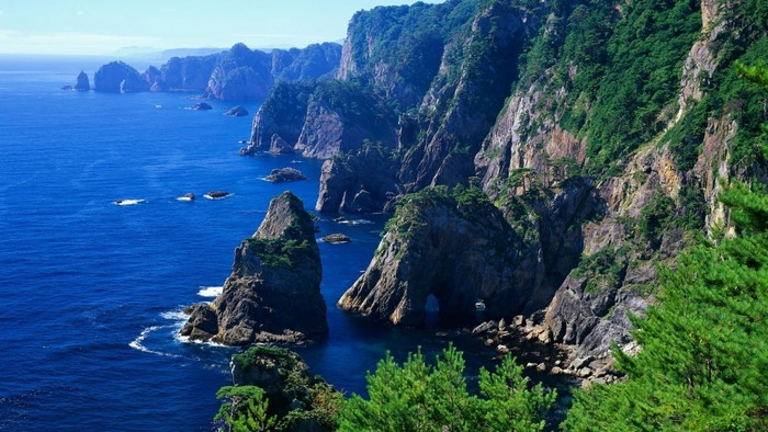 Rugged coastline with steep cliffs and blue sea
