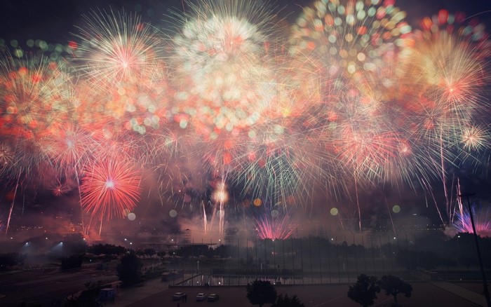 Fireworks display over a city at night
