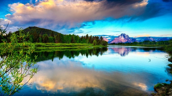 Mountain lake reflection at sunrise