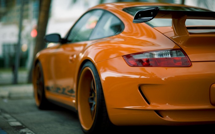 Orange Porsche 911 GT3 with a rear spoiler