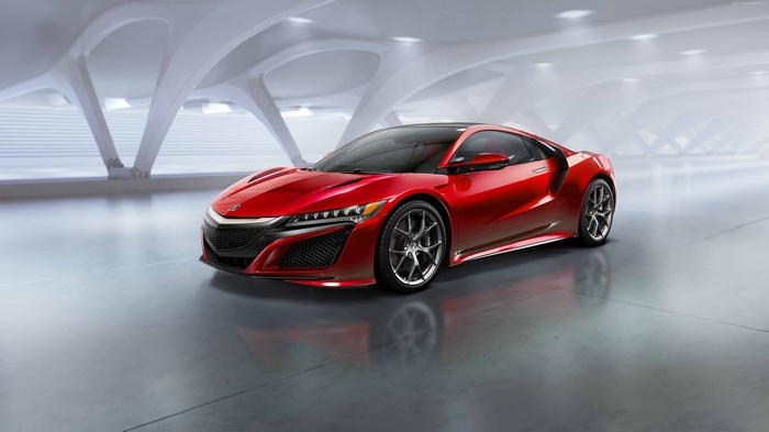 Red Acura NSX sports car in a modern showroom