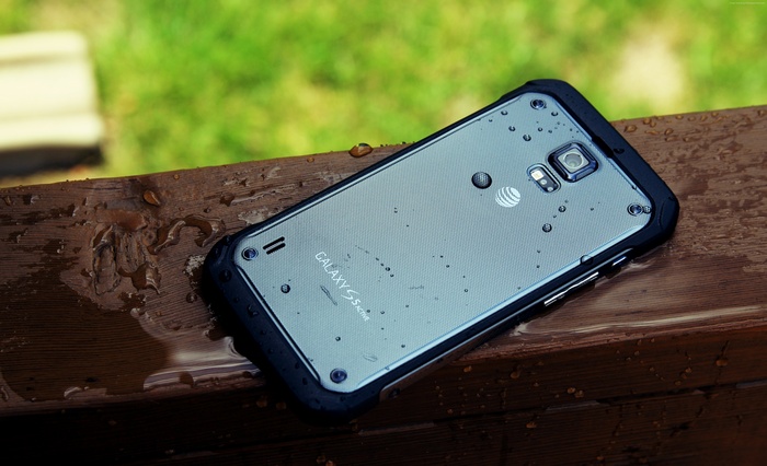 Samsung Galaxy S6 Active on a wet wooden surface