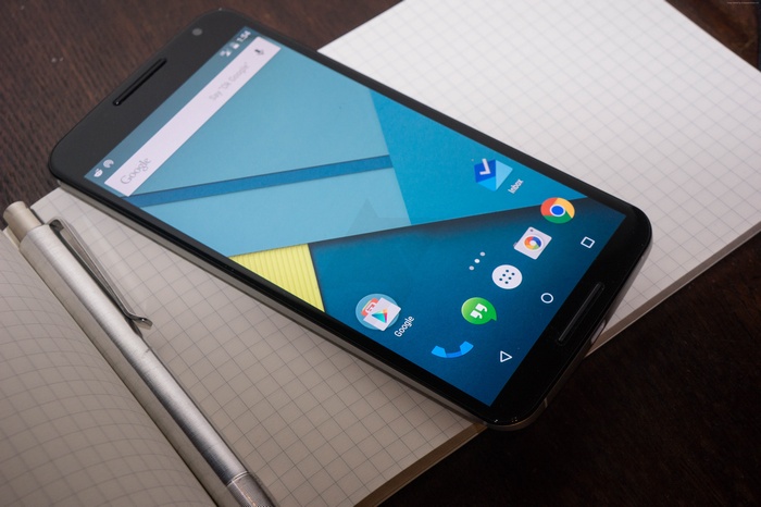 Motorola Nexus 6 smartphone on a notebook with a pen