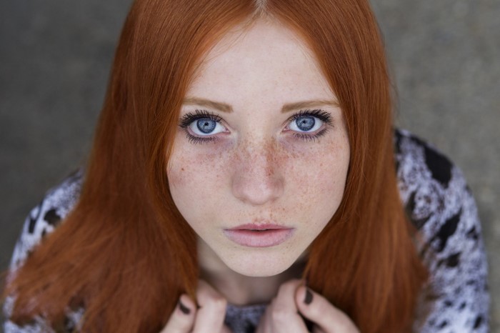 Portrait of a Redhead Woman with Blue Eyes and Freckles
