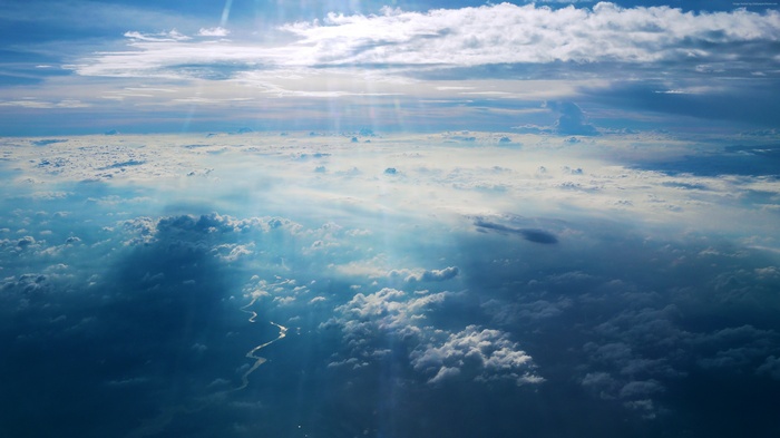 River and Clouds from Above with Sun Rays