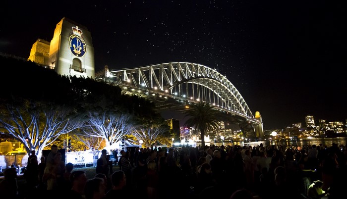 Sydney Harbour Bridge at night with crowd