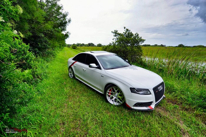 White Audi S4 Sedan parked on a grassy path