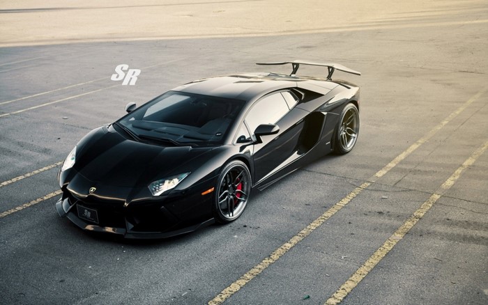 Black Lamborghini Aventador SVJ parked on asphalt