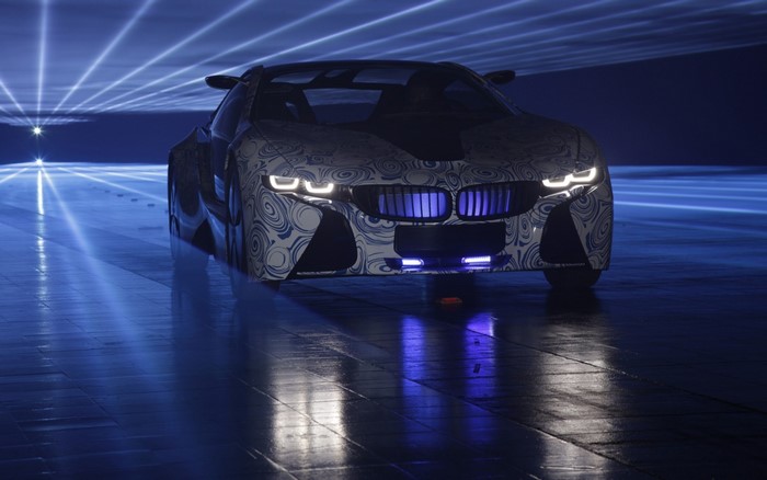BMW Car with Illuminated Headlights at Night