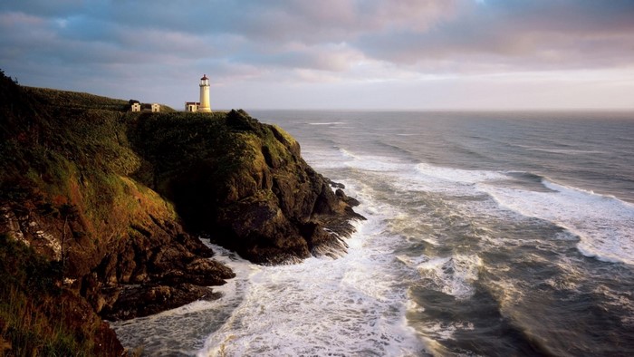 Lighthouse on a cliff overlooking the ocean