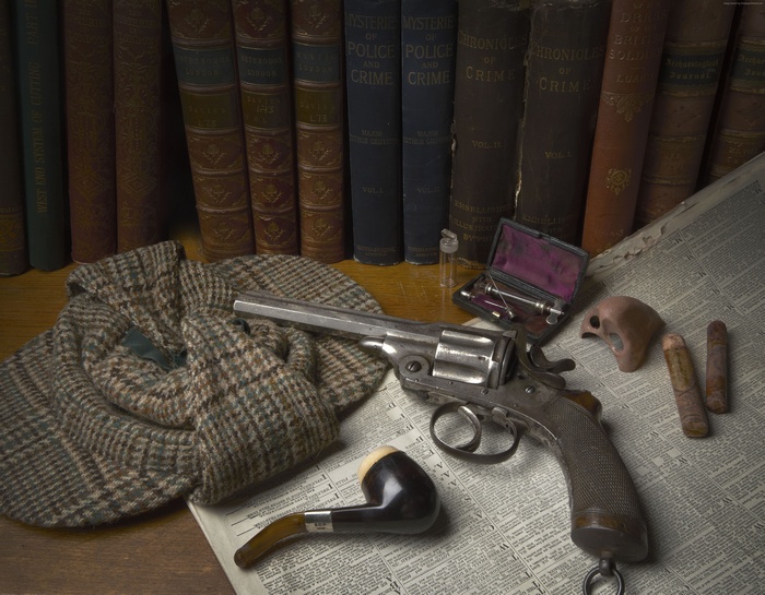 Antique revolver, pipe, and books