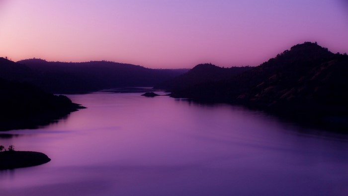 Purple lake and mountains at dusk