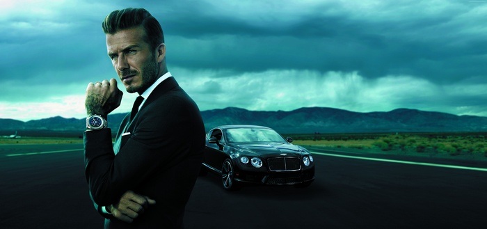 David Beckham in a suit with a Bentley car