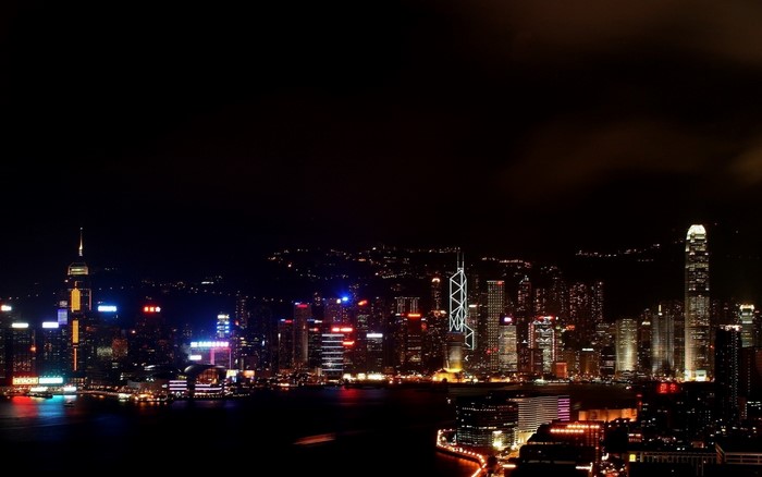 Hong Kong cityscape at night with illuminated skyscrapers