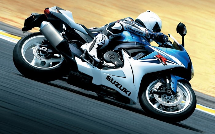 Suzuki GSX-R motorcycle with rider on a race track