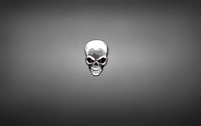 Skull with red eyes on a grey background