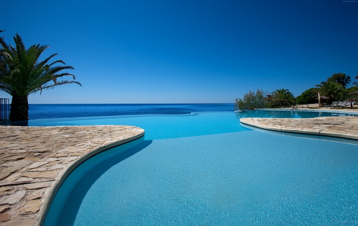 Infinity pool overlooking the sea in Sardinia, Italy