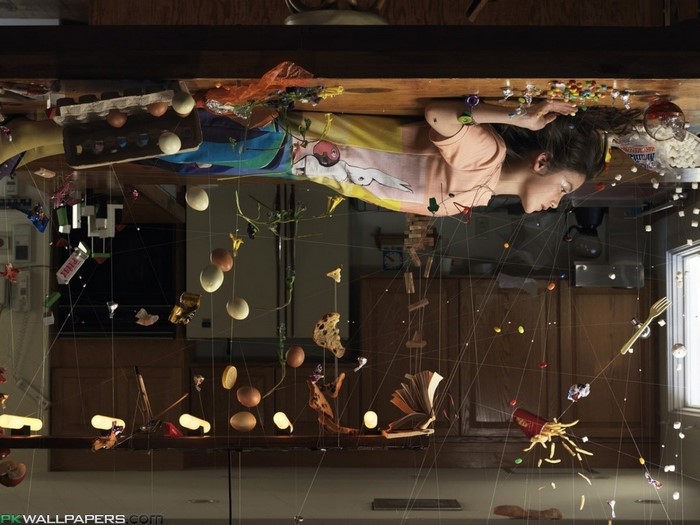 Girl suspended by wires with floating food and eggs