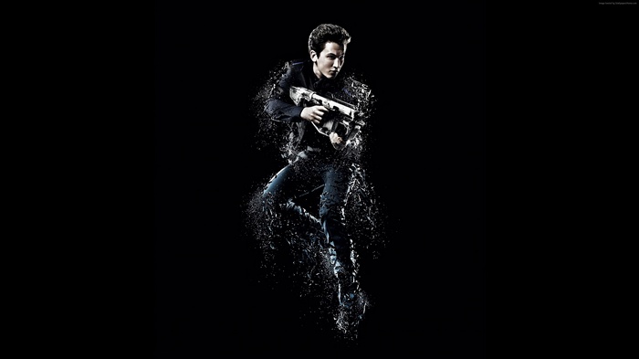 Miles Teller from Divergent holding a gun
