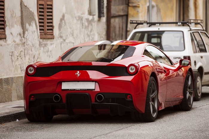 Red Ferrari 458 Speciale parked on street