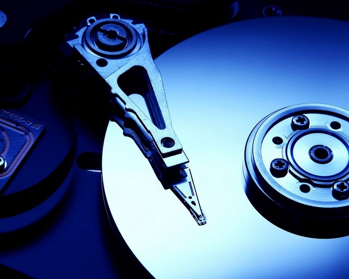 Close-up of a hard disk drive platter and read/write head