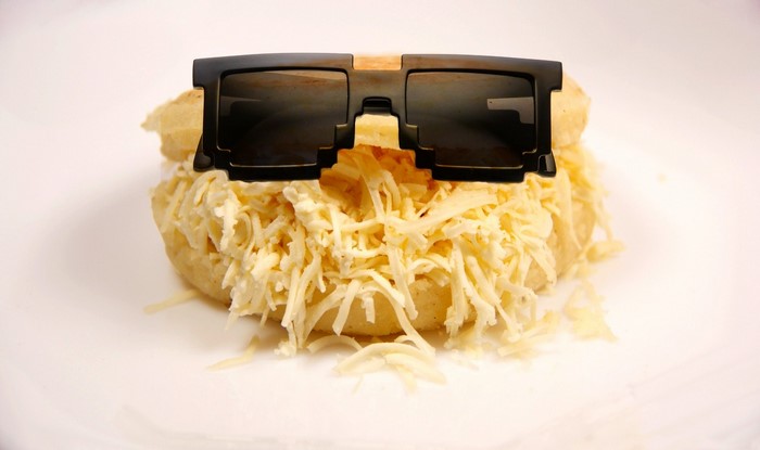 Arepa with shredded cheese and sunglasses