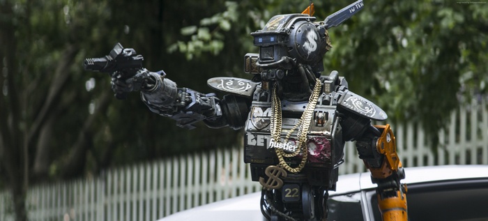 Chappie robot holding a gun