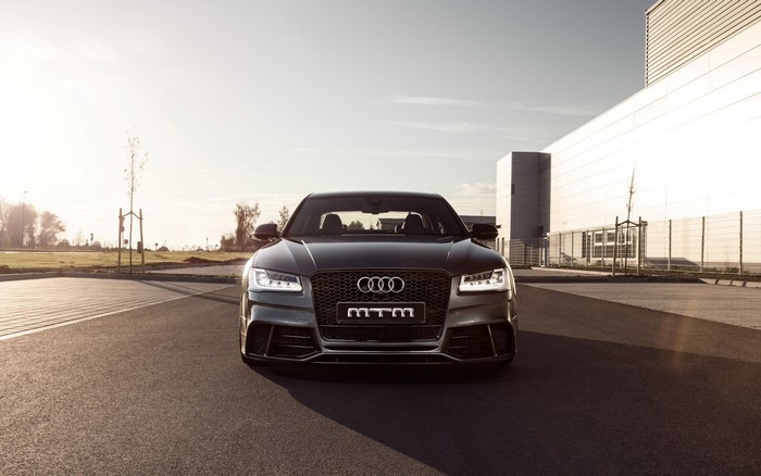 MTM Audi S8 parked in front of a modern building
