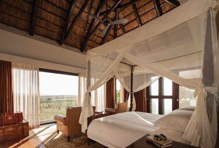 Four Seasons Safari Lodge Serengeti bedroom with canopy bed