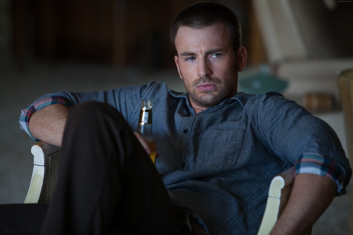 Chris Evans holding a beer bottle