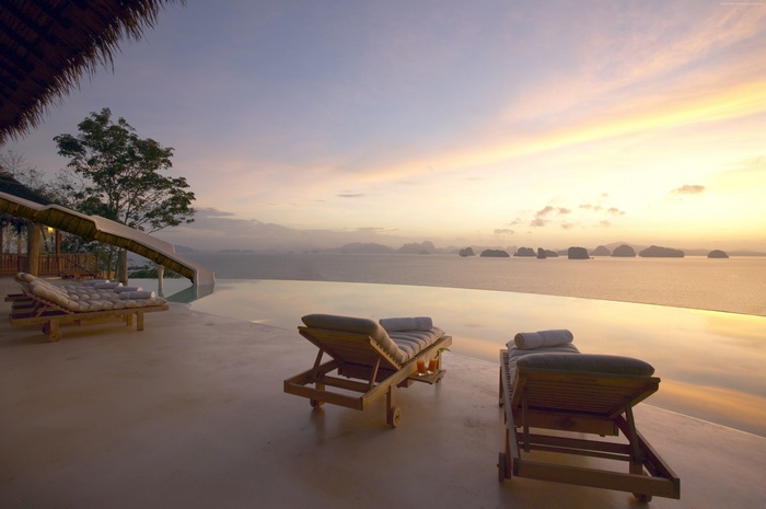 Infinity pool at Six Senses Yao Noi resort during sunrise