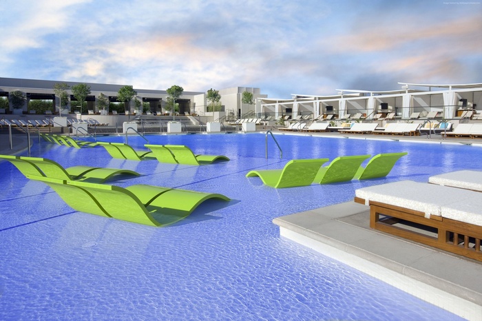 Luxury swimming pool with submerged lounge chairs