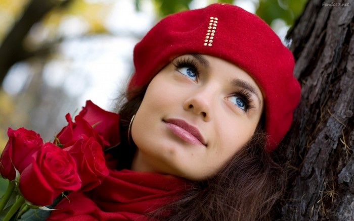 Woman in red beret and scarf with roses