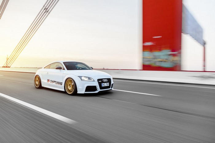 White Audi TT Coupe driving on a bridge