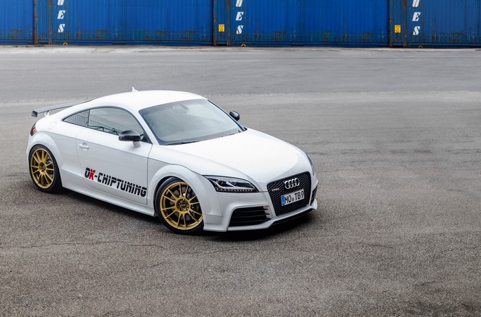 White Audi TT RS with gold wheels and custom decals