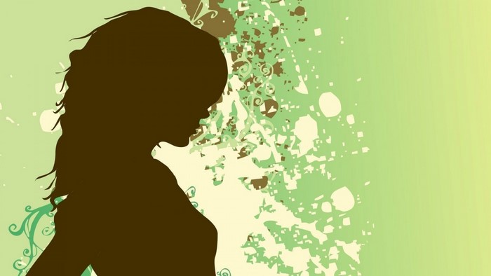 Silhouette of a woman with abstract green background