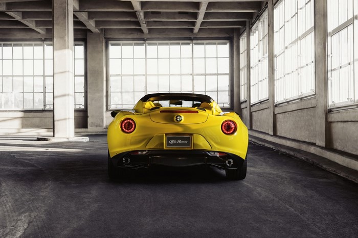 Yellow Alfa Romeo 4C Spider in industrial building