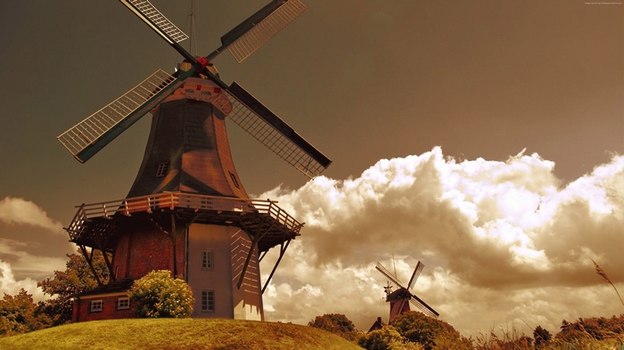 Windmills in the Netherlands under cloudy sky