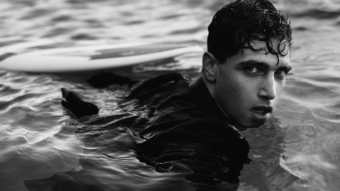 Fabio Mancini in water with surfboard