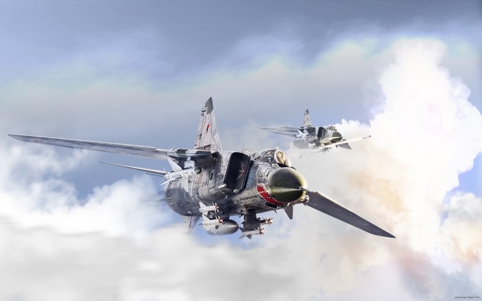 Two MiG-23 fighter jets flying through clouds