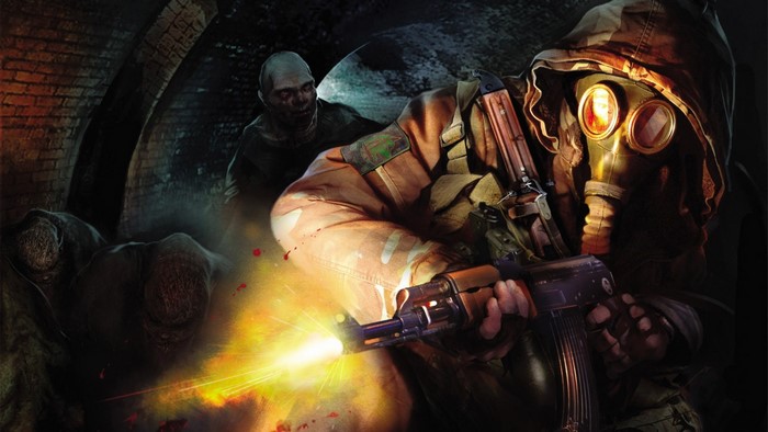Man in gas mask firing rifle at zombies in tunnel