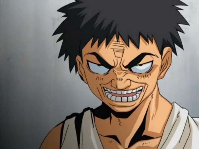 Anime character with spiky black hair and a menacing grin
